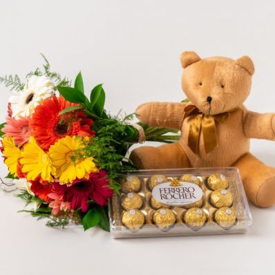 12 Gérberas, Chocolates e Pelúcia